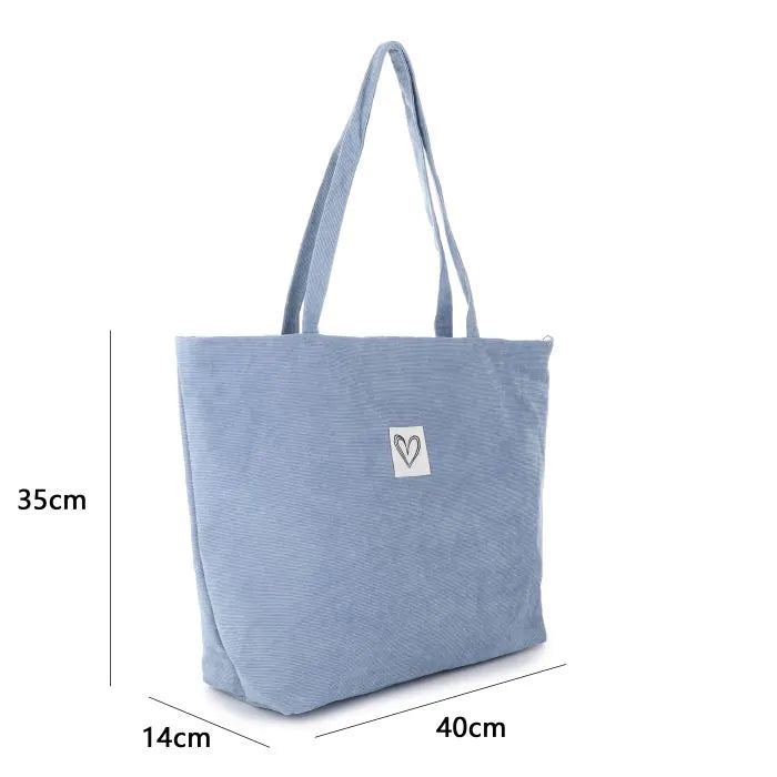 Ribfluwelen tas blauw