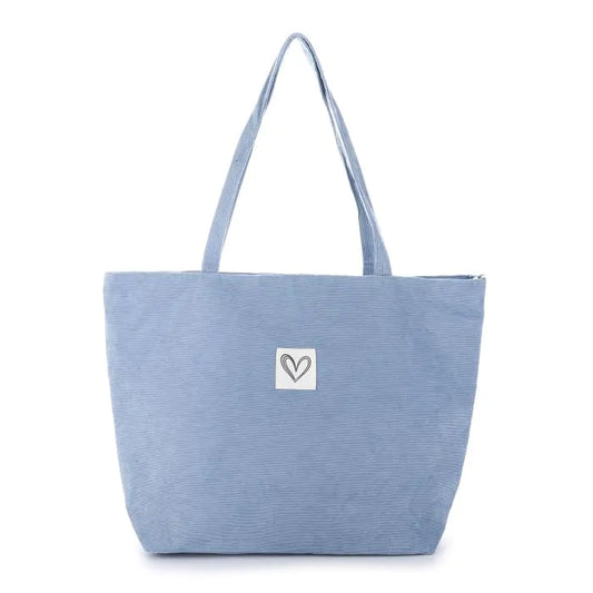 Ribfluwelen tas blauw